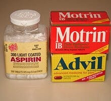 aspirin bottle and bottles of Motrin IB (ibuprofen) and Advil