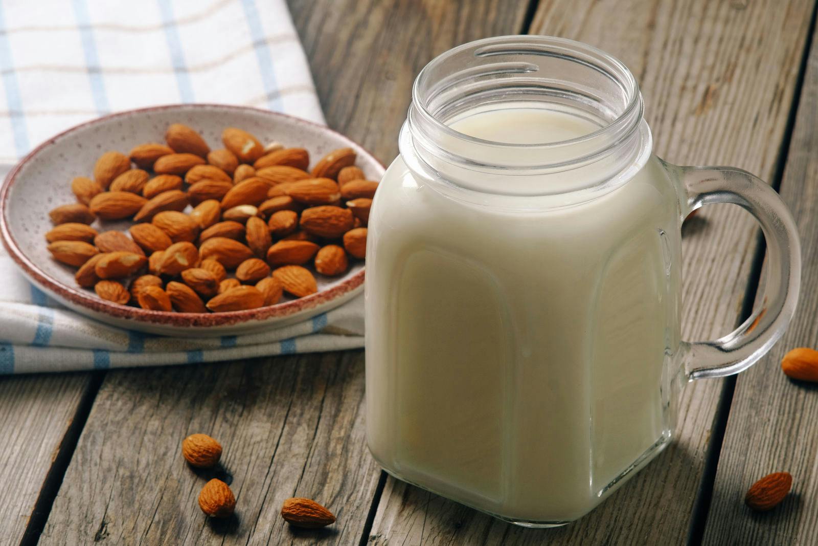 almonds and almond milk on table as part of dairy-free diet