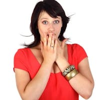 Woman in red top with hiccups, hands covering mouth