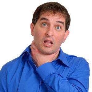 Man in blue dress shirt choking himself