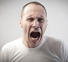 man screaming in pain or anger