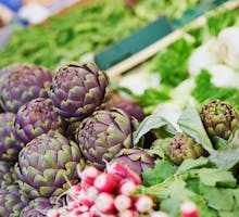 Fresh organic artichokes at a farmers market, ingredients for green Mediterranean diet