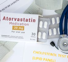 Atorvastatin pills with stethoscope