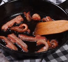 fried bacon in a frying pan