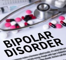 Sign reading Bipolar Disorder and an assortment of pills