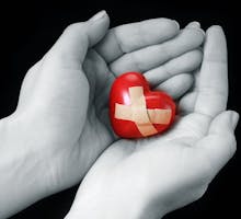 A heart with bandages on it signifying a broken heart