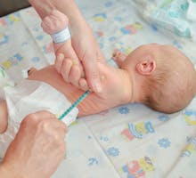 Newborn baby gets BCG vaccination