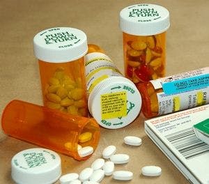 bottles of medications with warning stickers and information