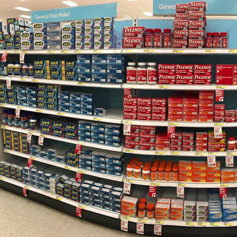 drugstore shelves with over the counter (OTC) pain relief products.