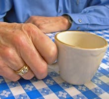 Elderly Hand With Coffee Cup