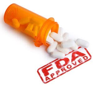 Bottle of Pills and a FDA APPROVED stamp