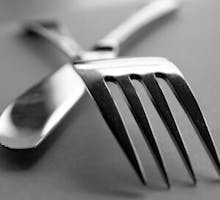 a crossed fork and knife