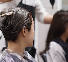 two women wait for hair dyes in salon