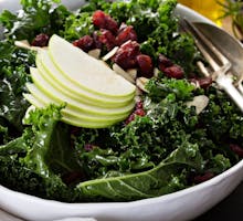 Kale salad with dried cranberry, almonds and apple