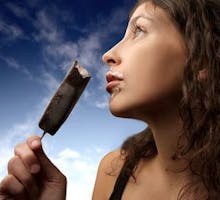 young woman enjoying an ice cream bar