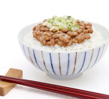a bowl with rice and natto, fermented beans linked to longer life in Japan