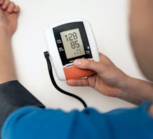 Man checking blood pressure with systolic blood pressure under 130