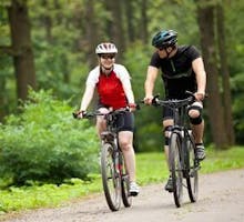 man and woman riding bicycles