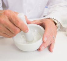 pharmacist holding mortar and pestle