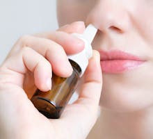 woman using a nasal spray