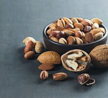 nuts in a bowl to control cholesterol naturally