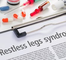 The diagnosis Restless legs syndrome written on a clipboard