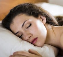 woman sleeping on a pillow, dreaming