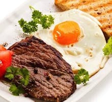 A steak and egg meal high in saturated fat