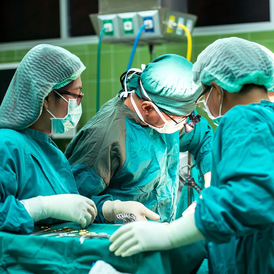 doctors performing surgery for appendicitis