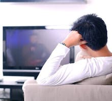 man watching television