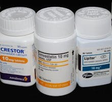 bottles of crestor lipitor and simvastatin cholesterol-lowering drugs