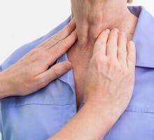 Problems with thyroid nurse examining a patient