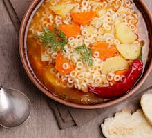 Hot soup with vegetables, pasta and chile pepper