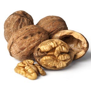 Walnut and a cracked walnut isolated on the white background with clipping past
