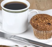 Fresh baked bran and flax muffin and coffee