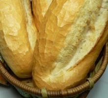 a basket with loaves of bread