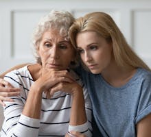 Confused older woman with daughter
