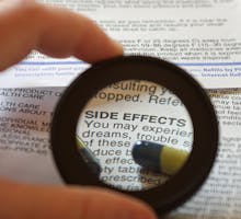 list of drug side effects with magnifying glass