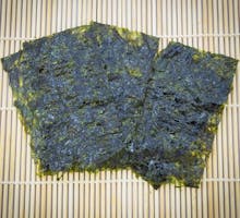 roasted seaweed sheets (nori) on traditional bamboo mat