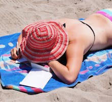 a woman sunbathing at the beach