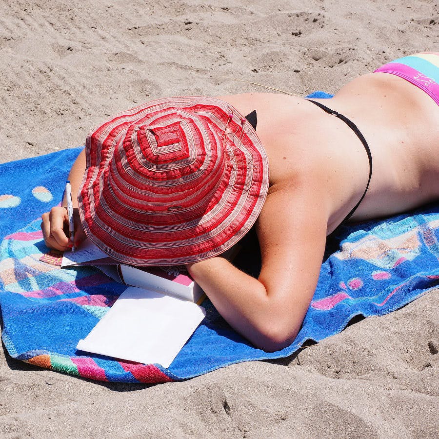 a woman sunbathing at the beach