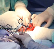 closeup of doctors performing a major surgery