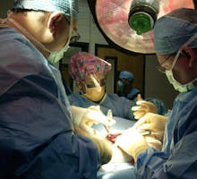 surgeons performing shoulder replacement surgery